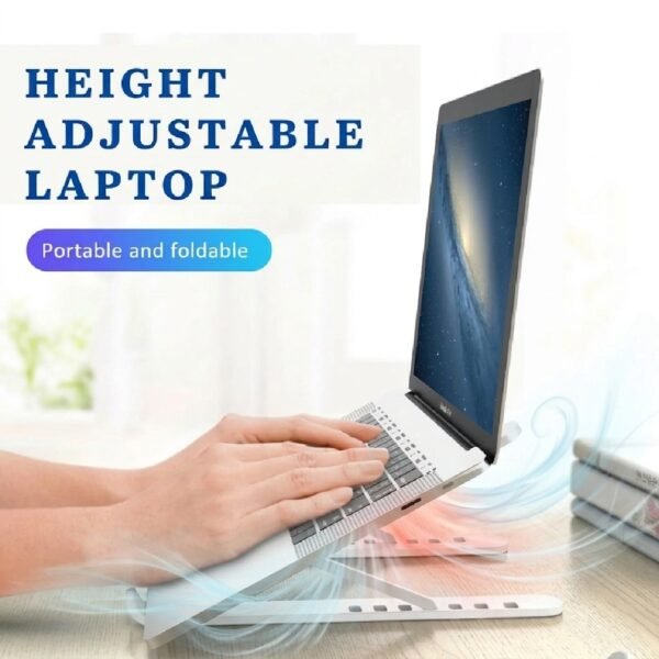 laptop stand is on table with laptop positioned on it Clearly shows the main purpose of laptop releasing heat below