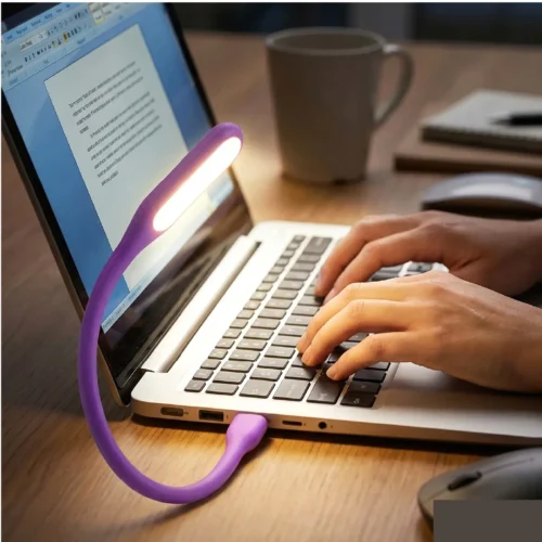 Person Working on laptop in night with usb led light on keyboard for visibility