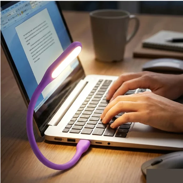 Person Working on laptop in night with usb led light on keyboard for visibility